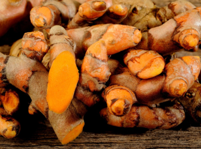 Organic dried turmeric roots sourced from Vietnam's highlands.